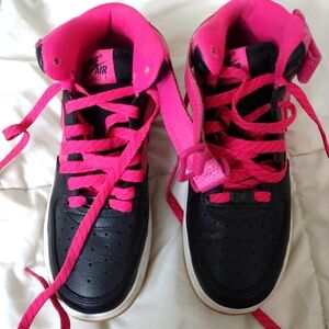 Pink and black nike mid top